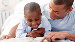 dad-son-reading-300x171-resized-600